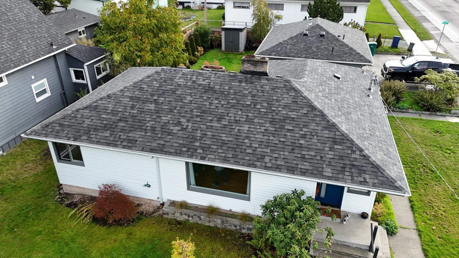 Front aerial view of an Anacortes home with new Malarkey Highlander shingles in Storm Grey