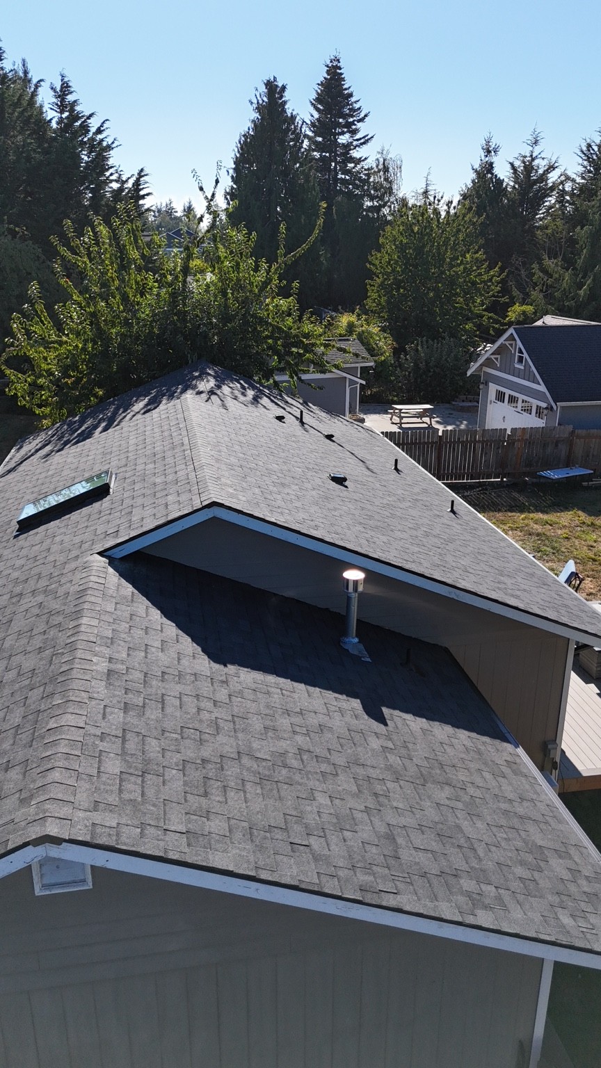 Closer view of Midnight Black shingles along the Anacortes roof’s ridges and roof planes