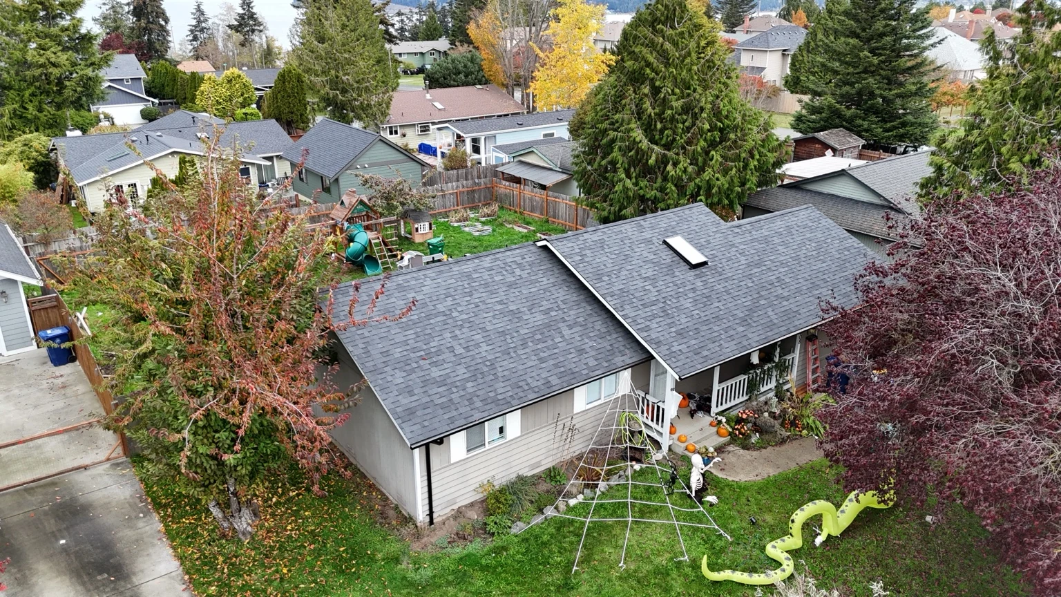 Wide aerial view of the Rockridge home and its new Midnight Black shingle roof in Anacortes, Washington